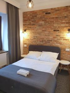Łóżko lub łóżka w pokoju w obiekcie Apartamenty Stary Browar Oleśnica