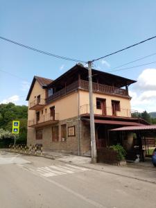 a building on the side of a street with at Guesthouse Smiljanić in Slavkovica
