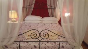 Postel nebo postele na pokoji v ubytování B&B in Arena L' Opera