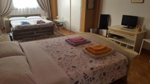 Postel nebo postele na pokoji v ubytování B&B in Arena L' Opera
