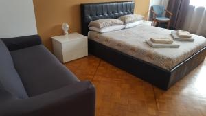 Postel nebo postele na pokoji v ubytování B&B in Arena L' Opera