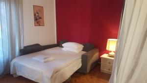 Postel nebo postele na pokoji v ubytování B&B in Arena L' Opera