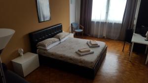 Postel nebo postele na pokoji v ubytování B&B in Arena L' Opera