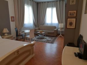 TV a/nebo společenská místnost v ubytování B&B in Arena L' Opera