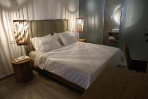 Postel nebo postele na pokoji v ubytování Icons Experience