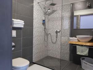 Koupelna v ubytování Studio apartman GRIZZLY + 27 fotografií