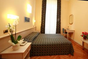 Voodi või voodid majutusasutuse Hotel Excelsior Splendide toas