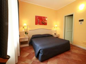 Voodi või voodid majutusasutuse Hotel Excelsior Splendide toas