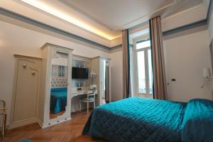 Voodi või voodid majutusasutuse Hotel Excelsior Splendide toas