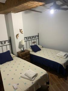 A bed or beds in a room at Alojamiento Rural El Chorrillo