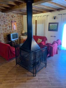 A television and/or entertainment centre at Alojamiento Rural El Chorrillo