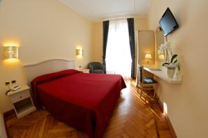 Voodi või voodid majutusasutuse Hotel Excelsior Splendide toas