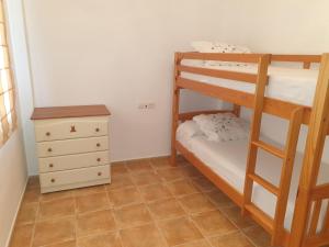 A bed or beds in a room at Riu Tolox