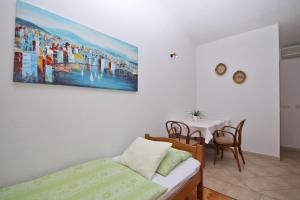 Postel nebo postele na pokoji v ubytování Adria Brela Apartments