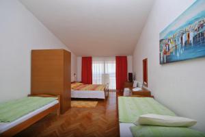 Postel nebo postele na pokoji v ubytování Adria Brela Apartments
