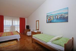 Postel nebo postele na pokoji v ubytování Adria Brela Apartments