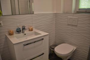 Koupelna v ubytování Hotel Garni Ilys Inn