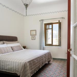 Posteľ alebo postele v izbe v ubytovaní Alma Libre Villas Chora