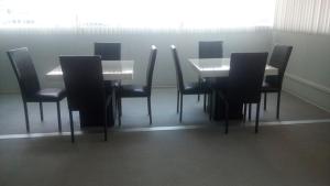 a dining room with a table and chairs at BONITTO INN® Monterrey Norte in Monterrey