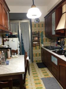 A kitchen or kitchenette at CAPO PELORO RELAX