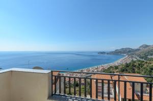 a view of the ocean from a balcony at CASA VACANZE ANDREANA in Letojanni