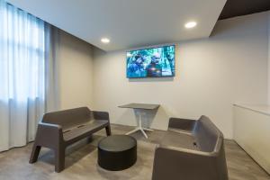 TV a/nebo společenská místnost v ubytování GoTì Hotel
