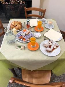 a table with breakfast foods and drinks on it at La spagnola in Amantea