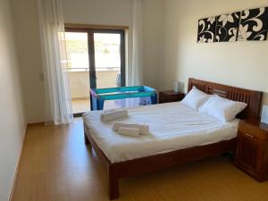מיטה או מיטות בחדר ב-High quality T2 apartment In SMP