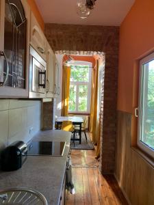 a kitchen with a counter and a dining room at Villa 25 in Gartz an der Oder