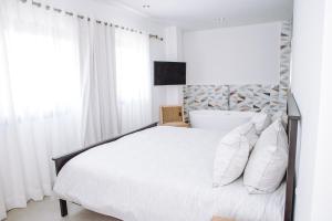 Postel nebo postele na pokoji v ubytování Modern Villa with Pool in Punta Cana + 38 fotografií