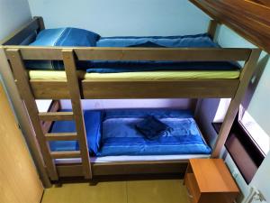 Postel nebo postele na pokoji v ubytování Chata Šumná