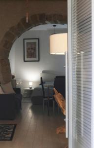 a living room with a couch and a table at SAN GIACOMO LOFT in Caltagirone