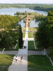 a view of a park with a red and white boat at Domitys - Galilée in Cergy +3 photos