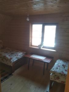 Postel nebo postele na pokoji v ubytování Садиба Під Чертежиком