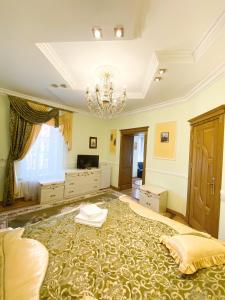 Postel nebo postele na pokoji v ubytování Петрос Family Hotel