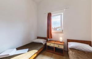 Posteľ alebo postele v izbe v ubytovaní Apartmani Valdebek