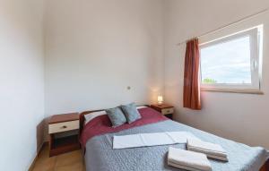 Posteľ alebo postele v izbe v ubytovaní Apartmani Valdebek