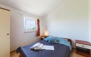 Posteľ alebo postele v izbe v ubytovaní Apartmani Valdebek