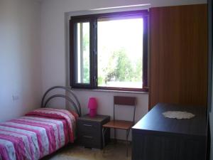 Een bed of bedden in een kamer bij Appartamento Sofia - Nord Sardegna - Badesi