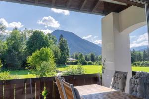 a view from the balcony of a house with a table and chairs at Im Schneewinkl in Schönau am Königssee