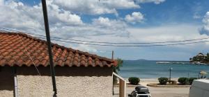 a house with a view of the beach and the ocean at Irida seafront apartment in Kiveri