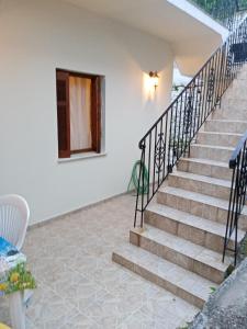 a set of stairs leading to a house at Dolphins DreamHouse in Agios Ioannis Pelio