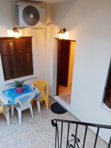 a small dining room with a table and chairs at Dolphins DreamHouse in Agios Ioannis Pelio
