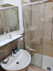 a bathroom with a sink and a shower at Montella 2 in Spoleto +14 photos