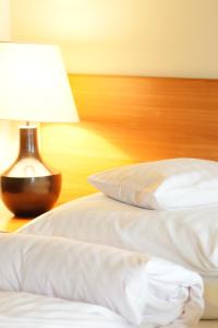 Łóżko lub łóżka w pokoju w obiekcie Hotel Grodzki