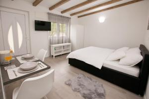 Posteľ alebo postele v izbe v ubytovaní Studio apartments Tara