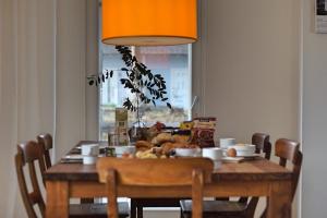 a dining room table with food on it at Haus unter den drei Bäumen - Urlaub auf der Sonneninsel Usedom in Zirchow