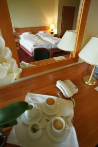 Łóżko lub łóżka w pokoju w obiekcie Hotel Grodzki