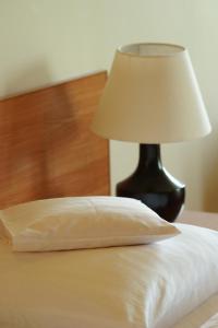 Łóżko lub łóżka w pokoju w obiekcie Hotel Grodzki