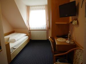 Postel nebo postele na pokoji v ubytování Hotel Ebner